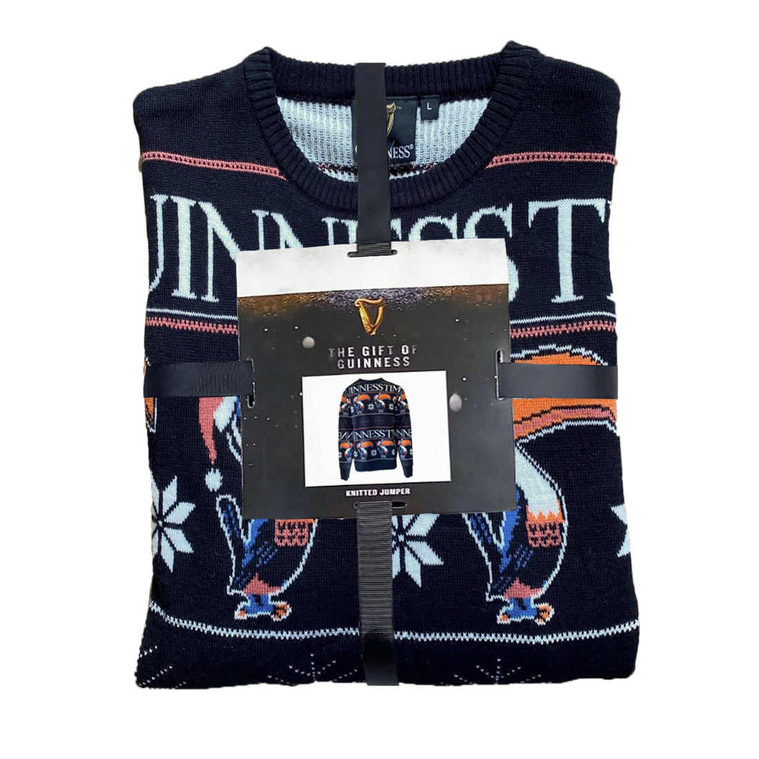 folded black sweater with toucans wearing red Christmas hats and Guinness time written in white wrapped with black ribbon