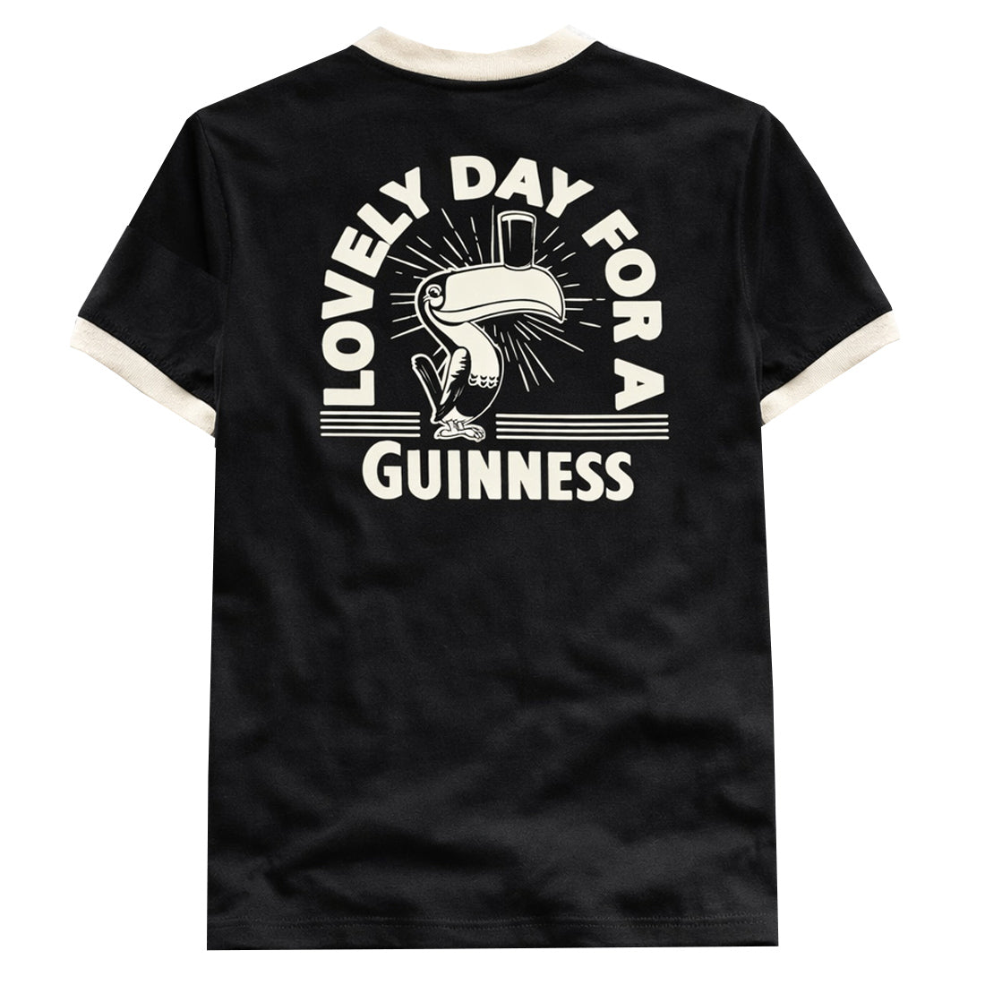 Back view of black t shirt featuring a large cream toucan graphic and the text Lovely Day For A Guinness