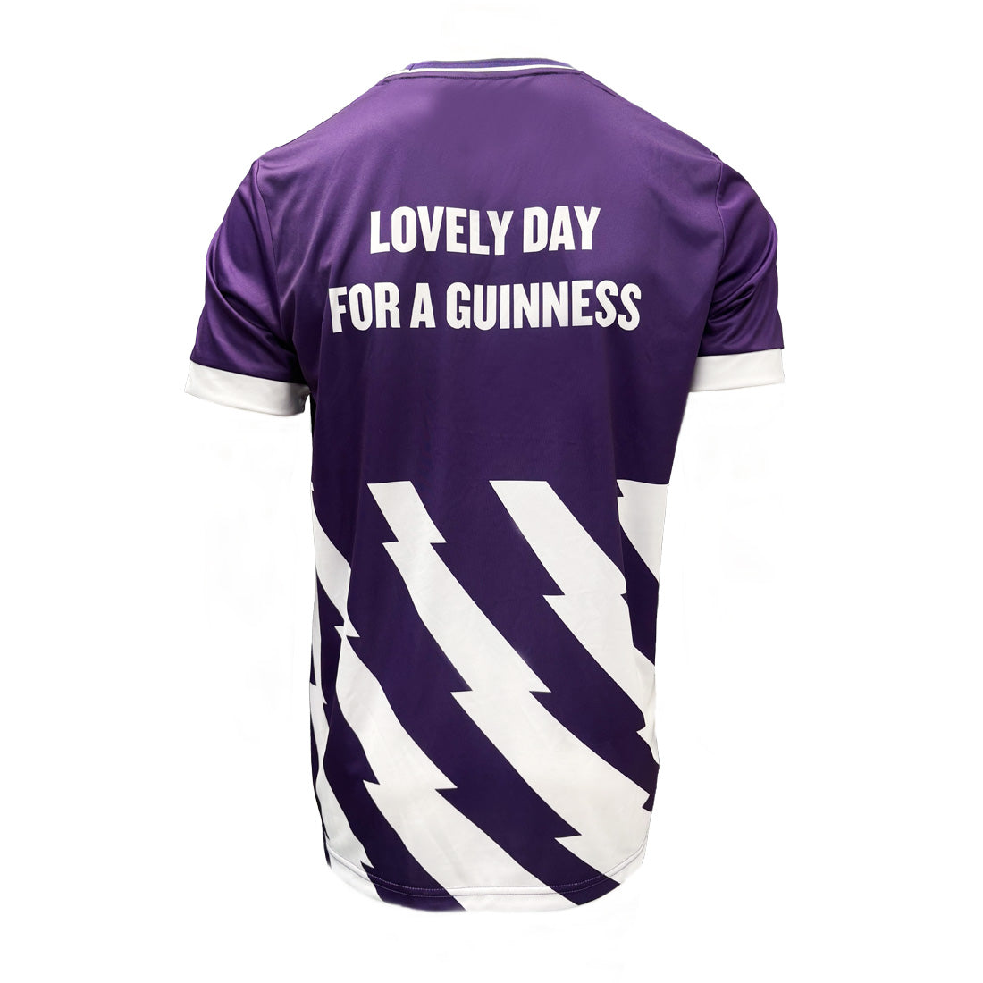 Back view of purple Guinness football top with white text Lovely Day For A Guinness and diagonal white chevrons.