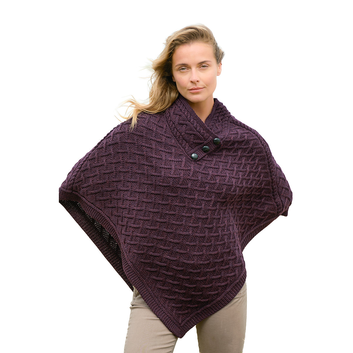 Model wearing NUA Plum Super Soft Merino Poncho with a lattice knit and a pointed hem