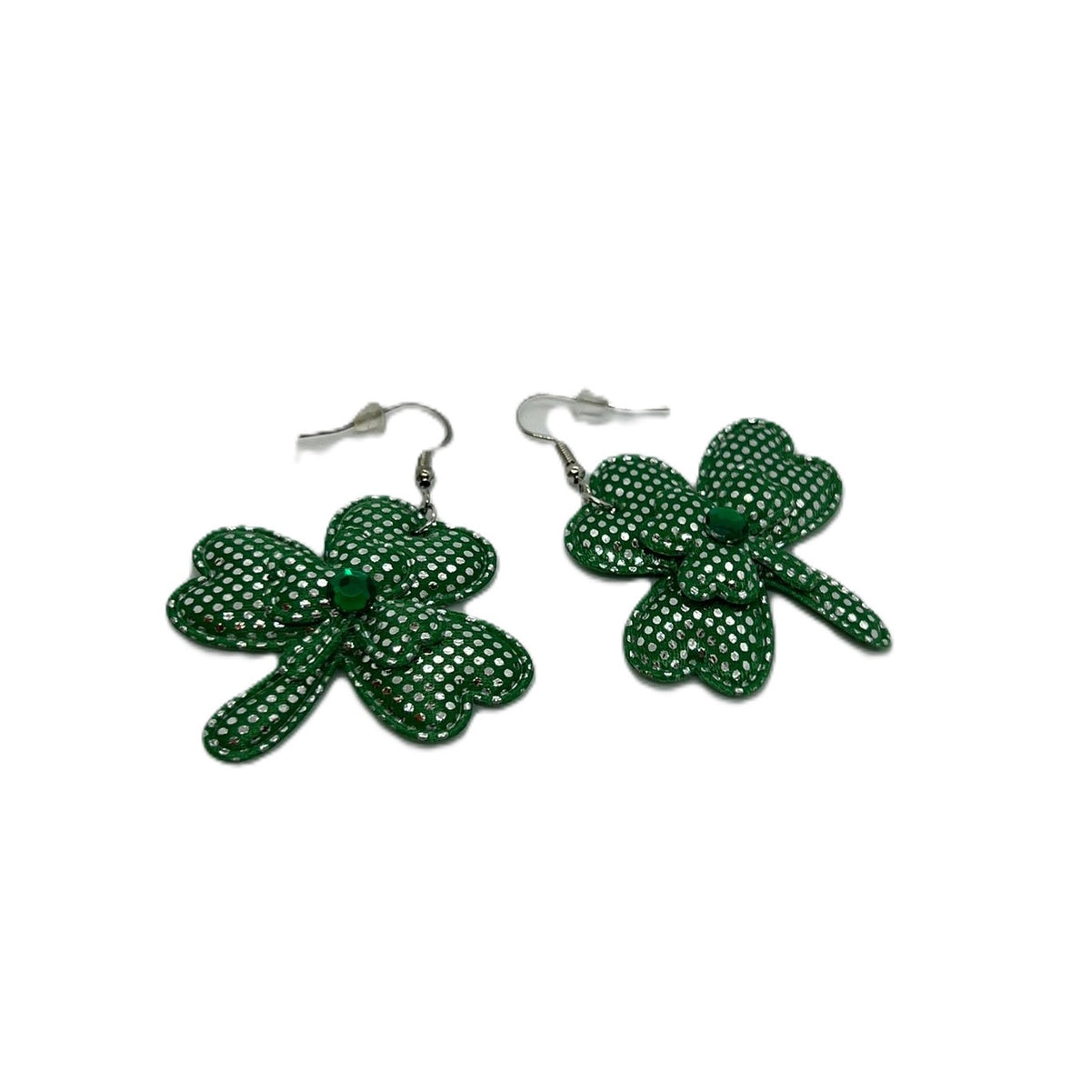 Pair of large green shamrock earrings with white polka dots on silver hooks.