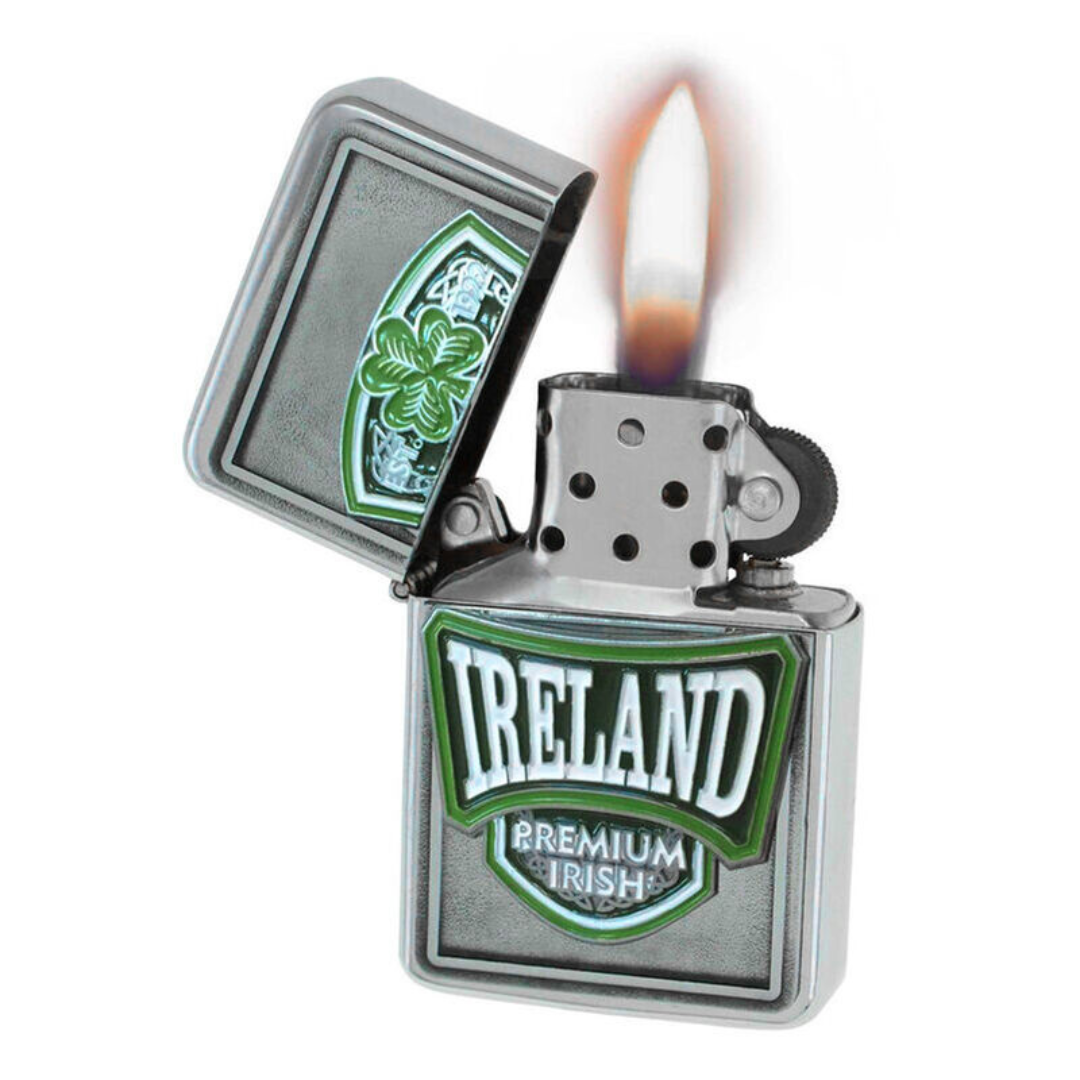 Metal lighter with Ireland emblem and flame, lid open showing clover design