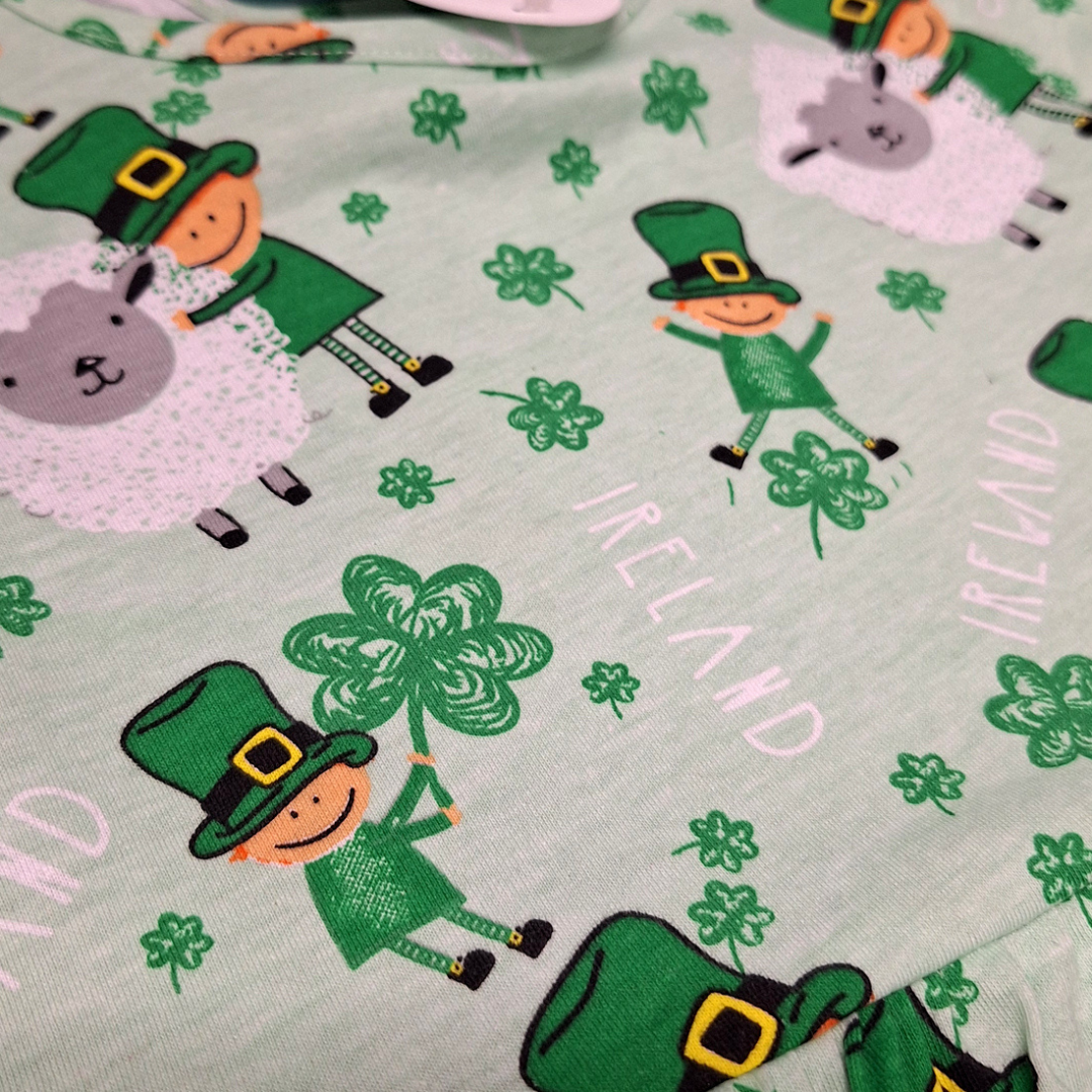 Pattern with leprechauns, shamrocks, sheep, and Ireland text on fabric