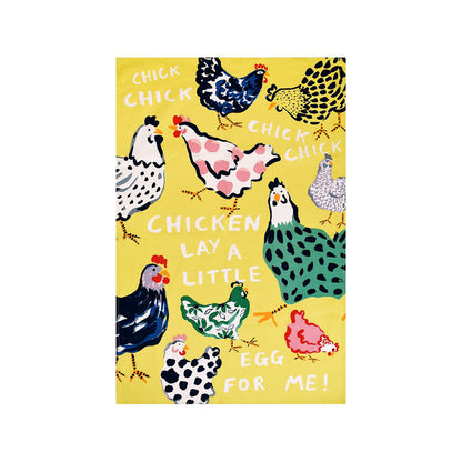 Yellow chicken print cotton tea towel with colorful hens and bold white lettering laid flat against a white surface