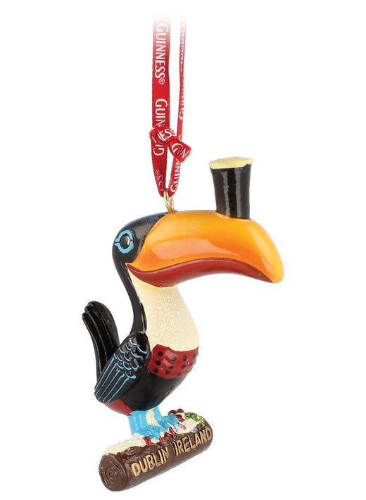 Colorful toucan ornament with a top hat and red ribbon hanger