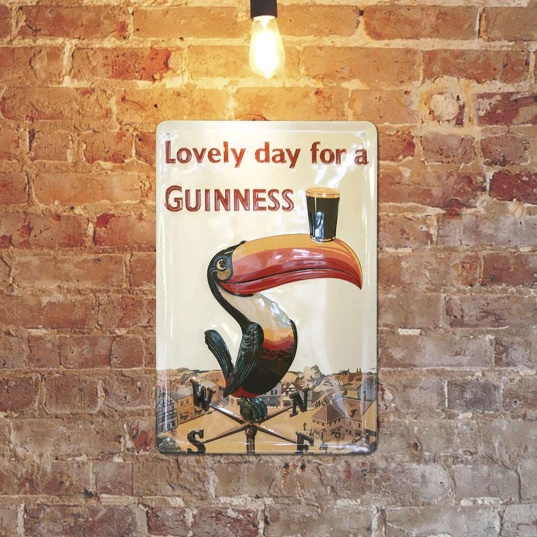 Vintage sign with a toucan balancing a Guinness pint on its beak