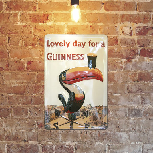 Vintage sign with a toucan balancing a Guinness pint on its beak