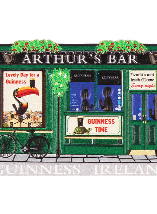 Green facade of Arthur's Bar with bicycle and Guinness advertisements