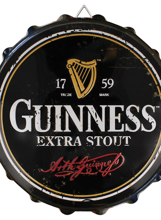 Round black Guinness Extra Stout sign with harp logo and red signature
