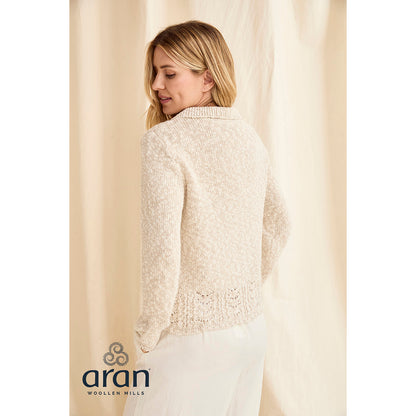 Side profile of cream knitted cardigan highlighting relaxed fit and crochet hem