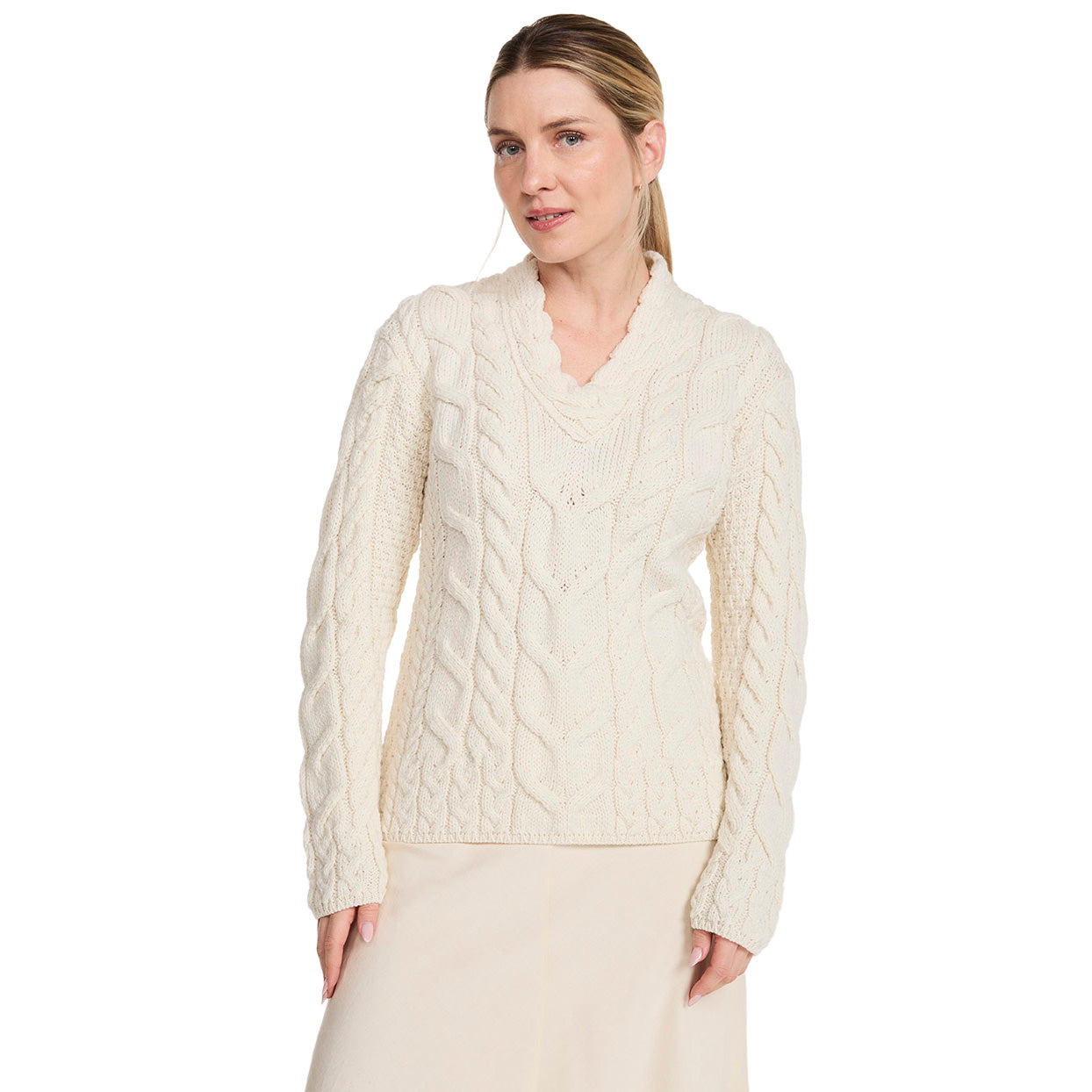 Cream Tralee V-Neck Merino sweater with chunky cable knit on a model