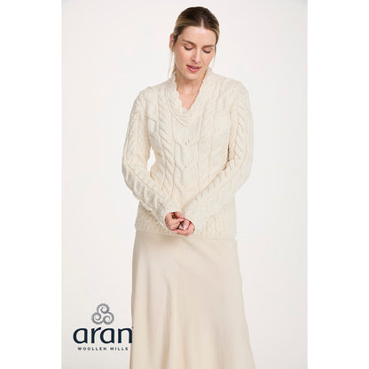 Cream Tralee V-Neck merino sweater with cable knit worn by a model