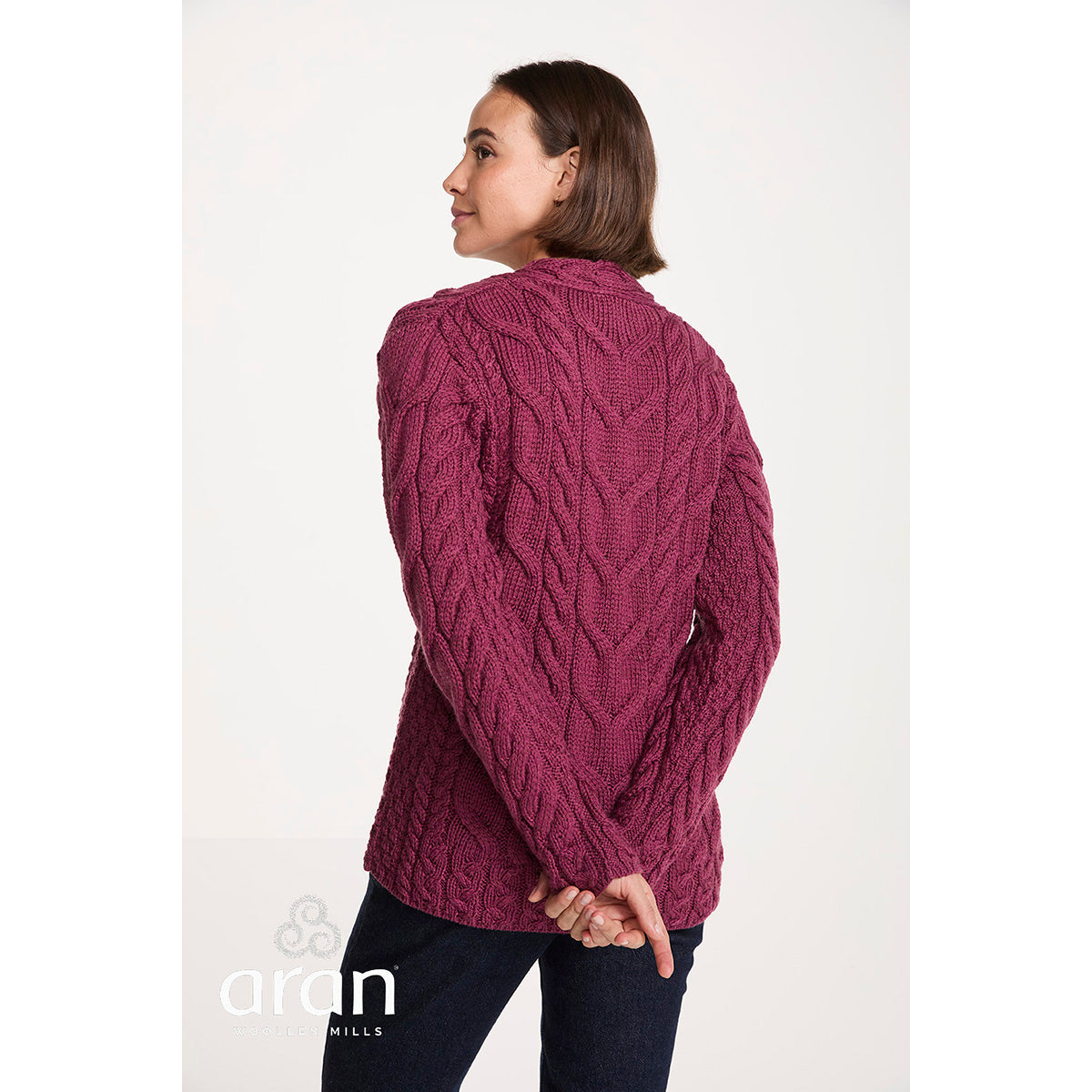 Back view of a model wearing the berry Tralee V-Neck sweater showing the knit texture and relaxed fit.
