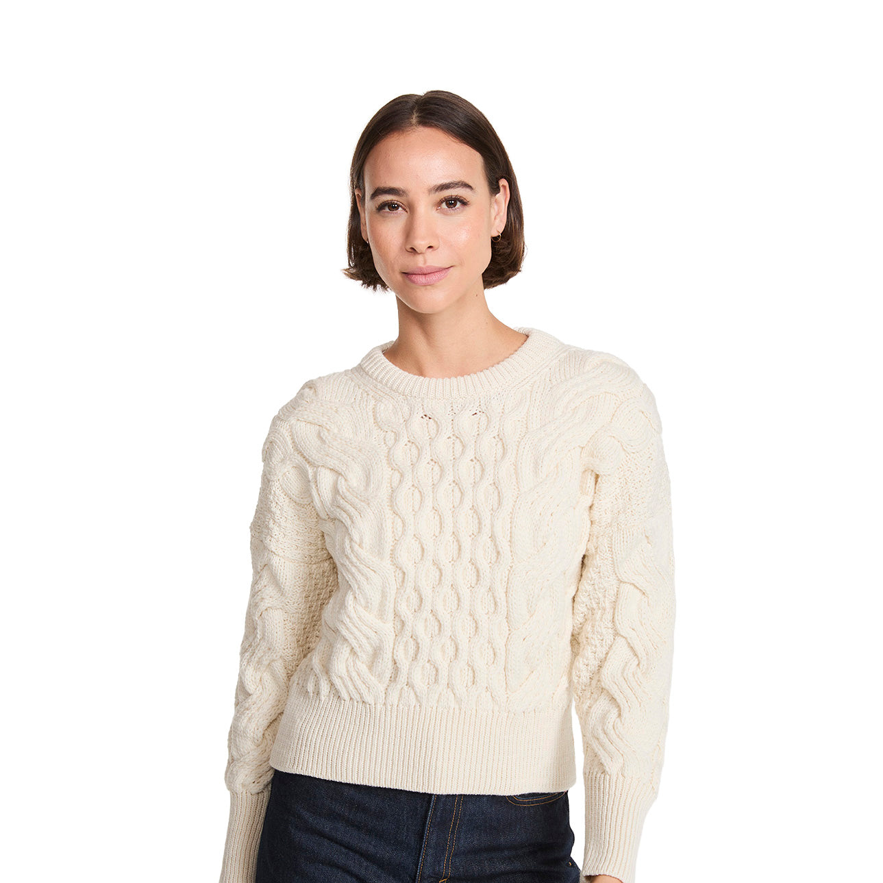 Cream cropped cable knit jumper on a model