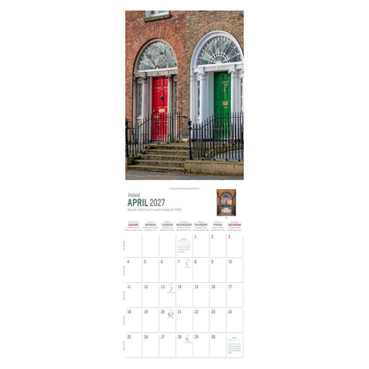 Colorful Georgian doors on a Dublin brick townhouse with stone arch and iron railing