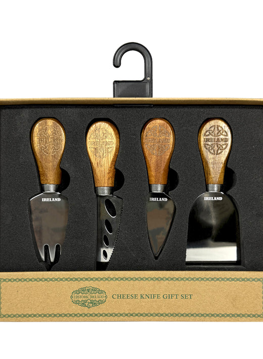 Set of four cheese knives with wooden handles in a gift box