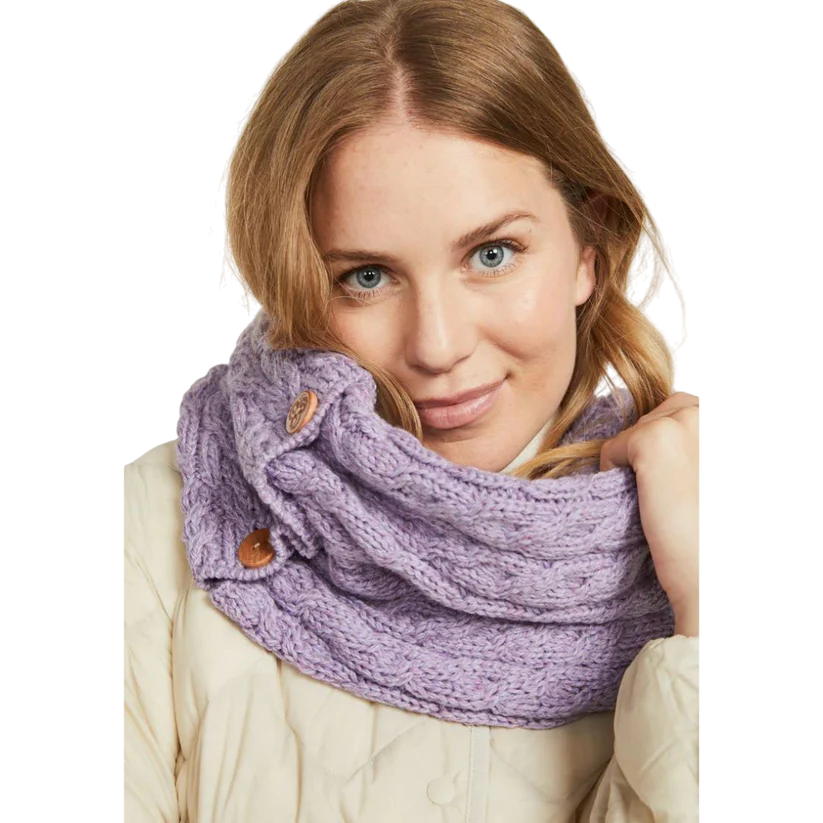 Woman wearing a lavender knitted scarf with wooden buttons
