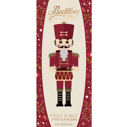 Nutcracker soldier illustration on red and beige festive chocolate bar packaging