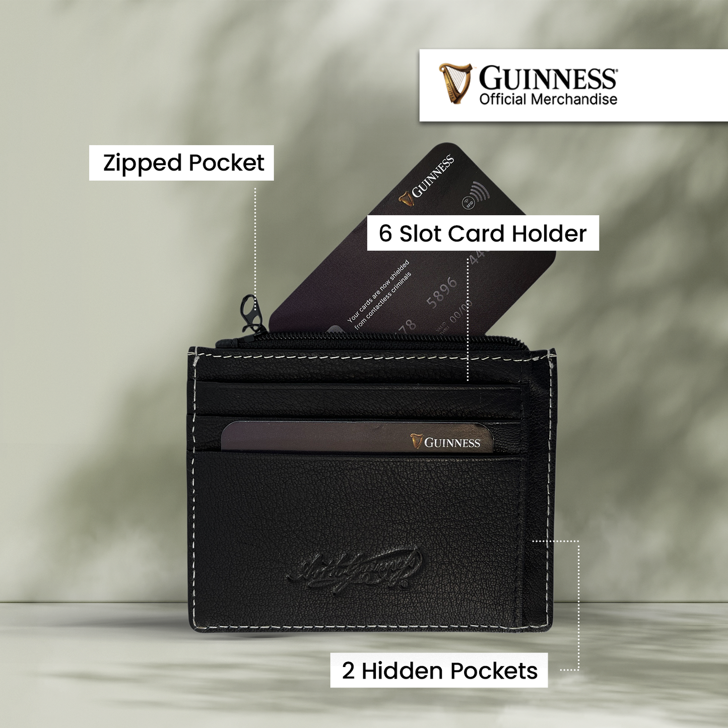 Guinness branded black leather card holder with zip pocket and multiple card slots.