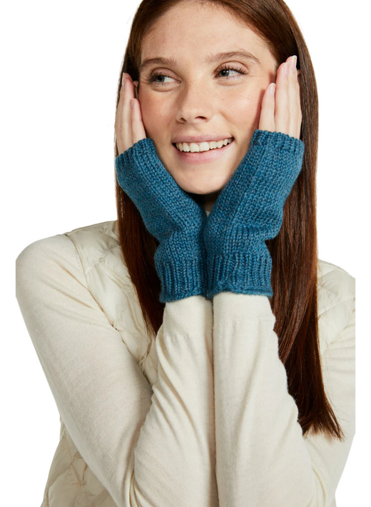 Smiling woman wearing blue fingerless gloves and cream long sleeves