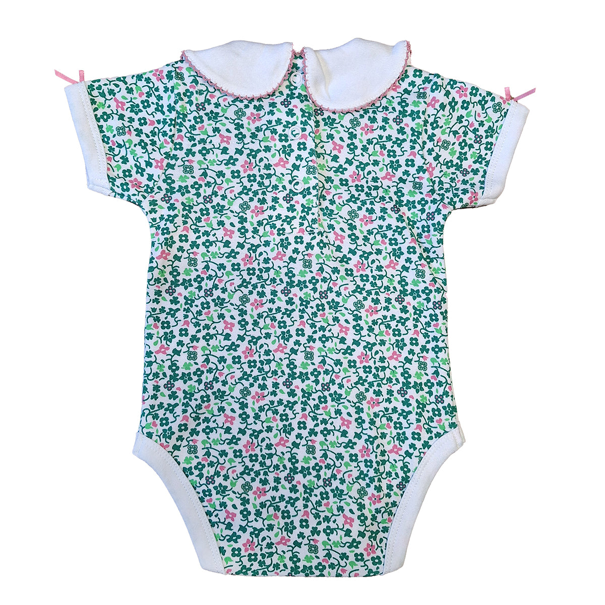 Back view of a floral shamrock baby vest with white collars pink trim and small pink bows