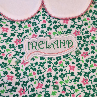 Close up of an Ireland label on green and pink floral print fabric