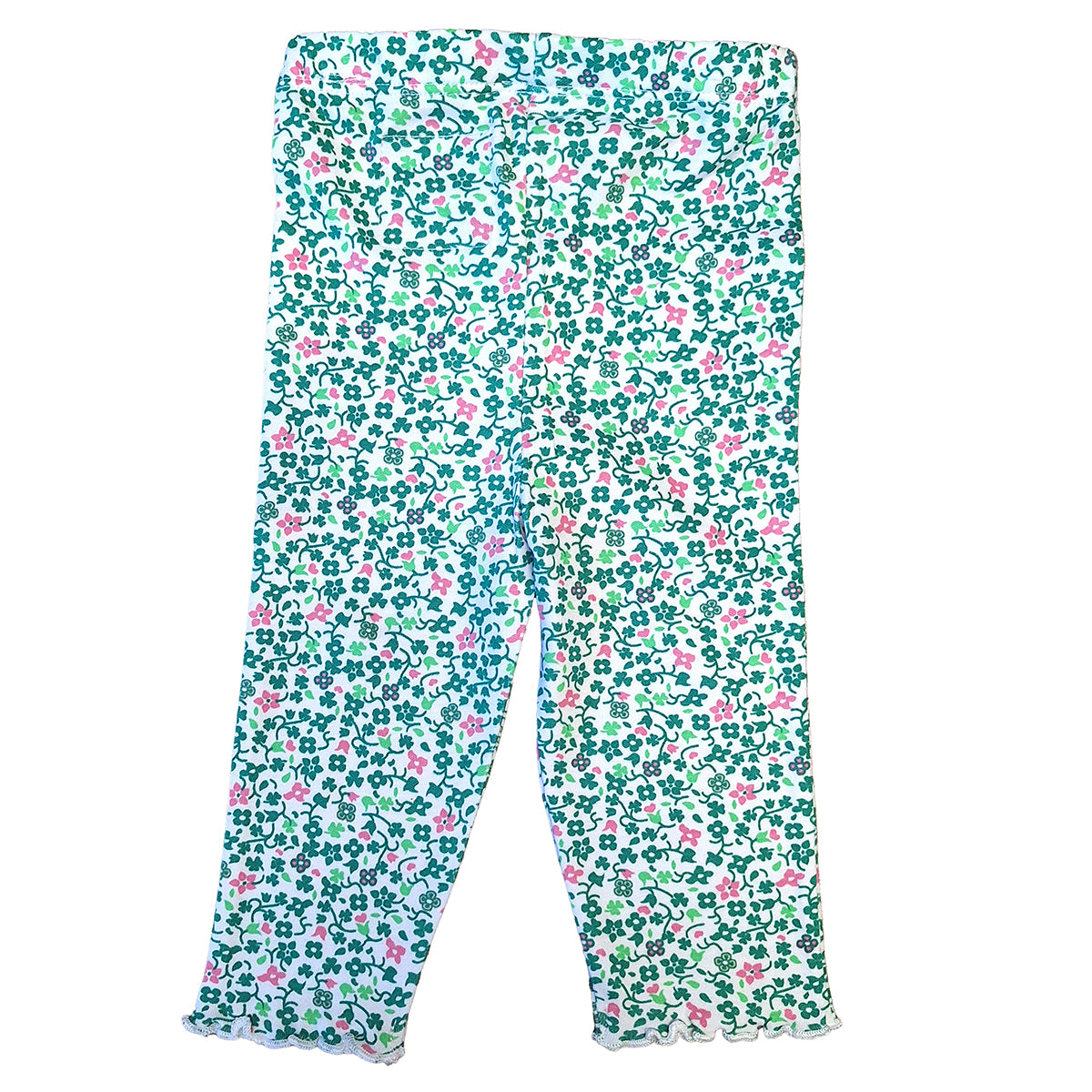 Baby leggings with teal shamrock floral print all over on white fabric and scalloped hems
