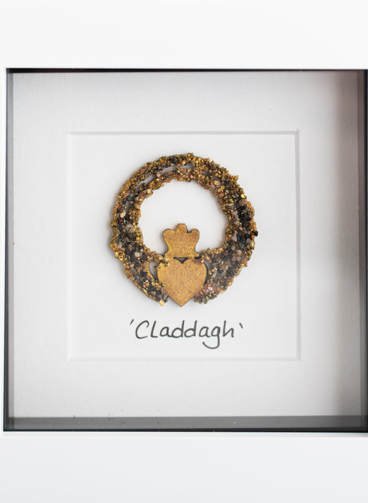 Framed Claddagh symbol made with gold and black textured materials