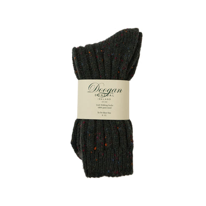 Dark green flecked wool sock with multicolored specks laid flat