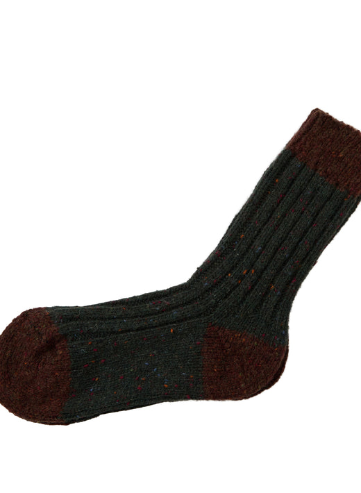 Flecked dark green Acre sock with burgundy toe heel and cuff on white background