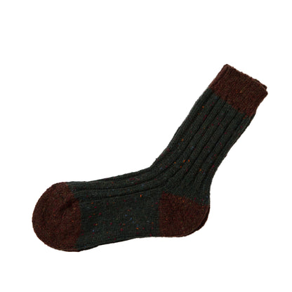 Flecked dark green Acre sock with burgundy toe heel and cuff on white background