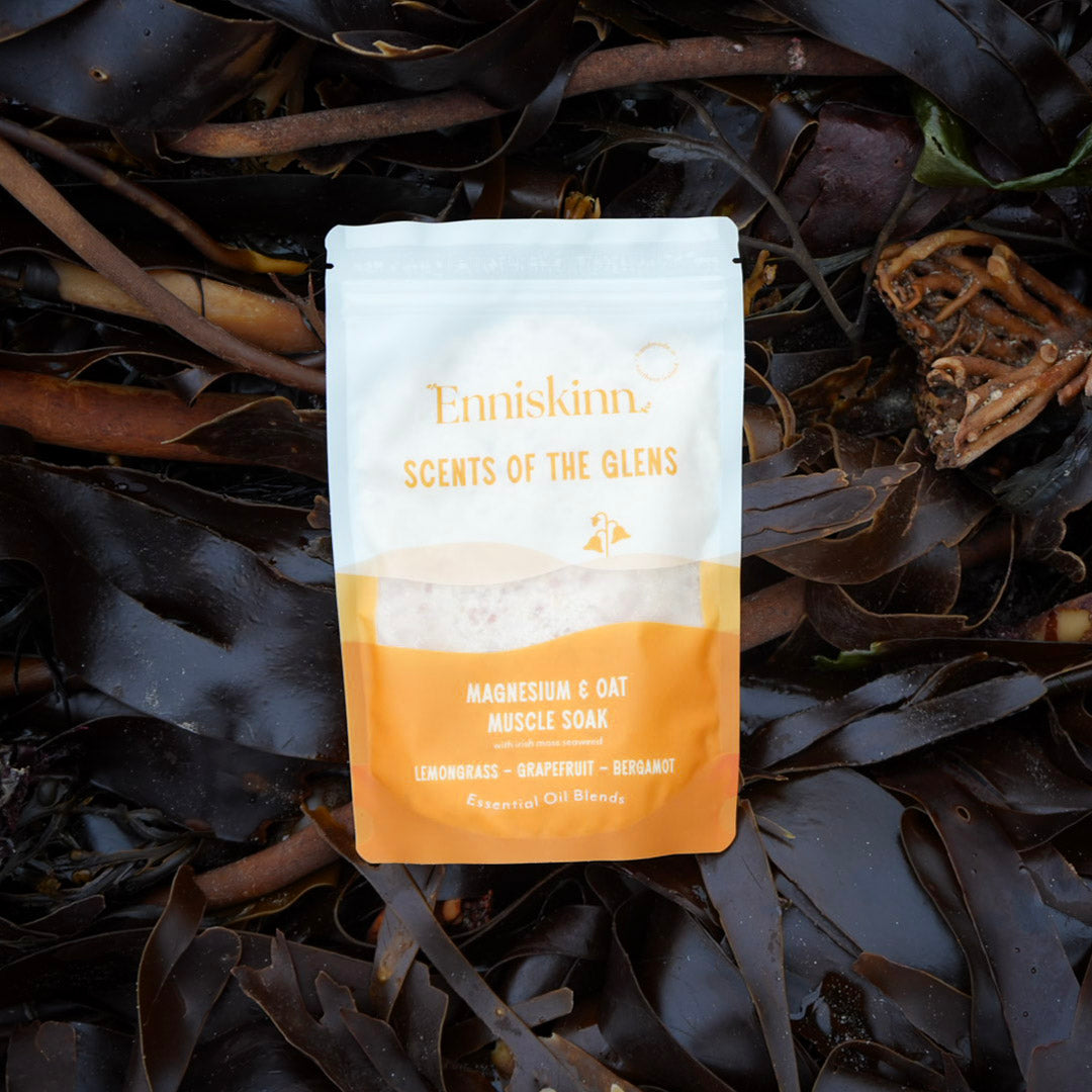 Enniskinn Scents of the Glens Magnesium and Oat Muscle Soak pouch resting on dark seaweed