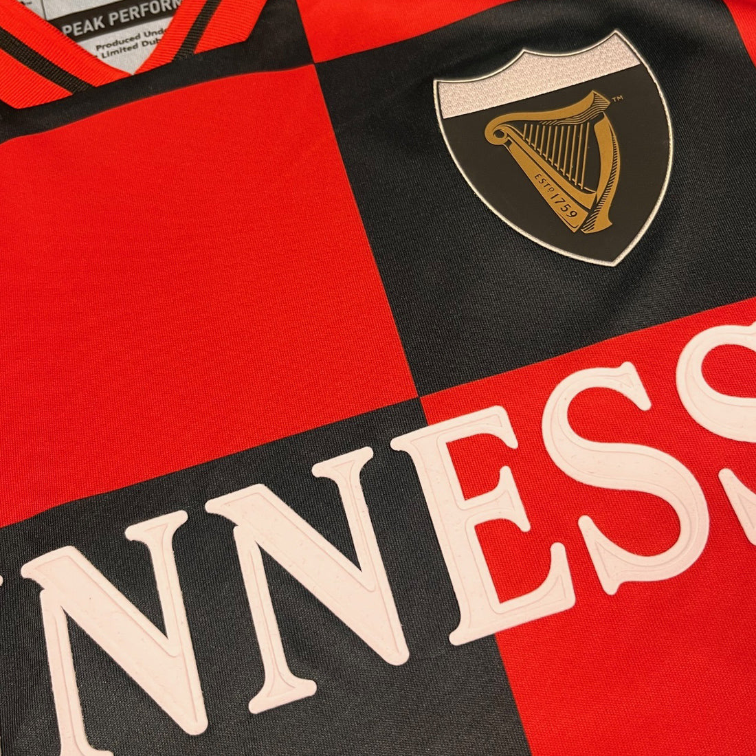 Guinness Black and Red Check Performance Top