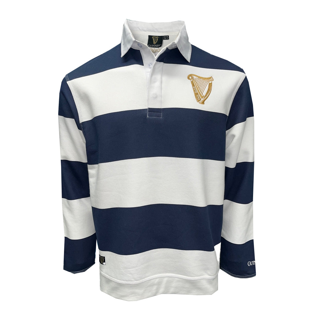 Guinness navy and white striped rugby shirt with gold harp crest on chest worn by a model in a bar.