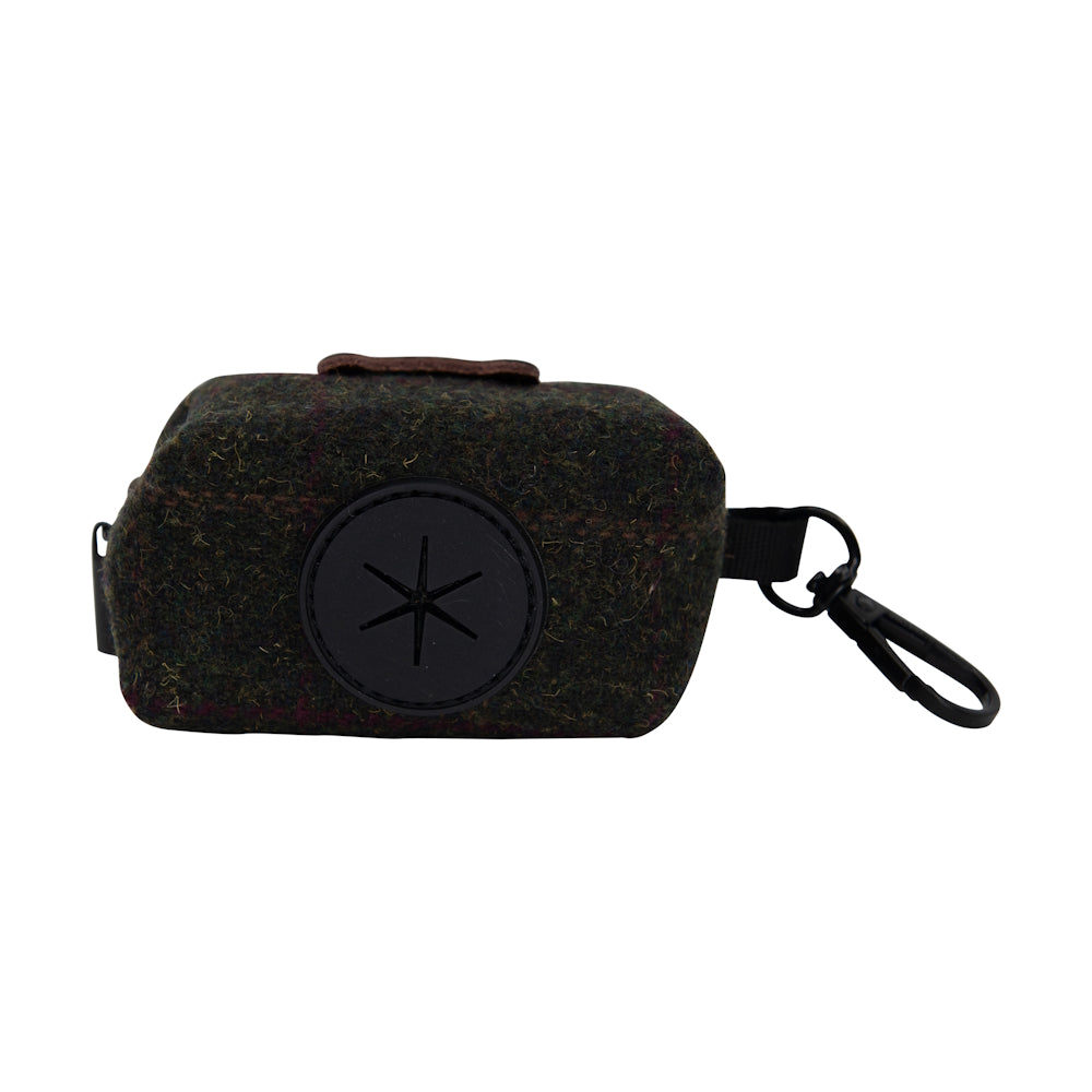 Small dark fabric pouch with a circular emblem and attached clip