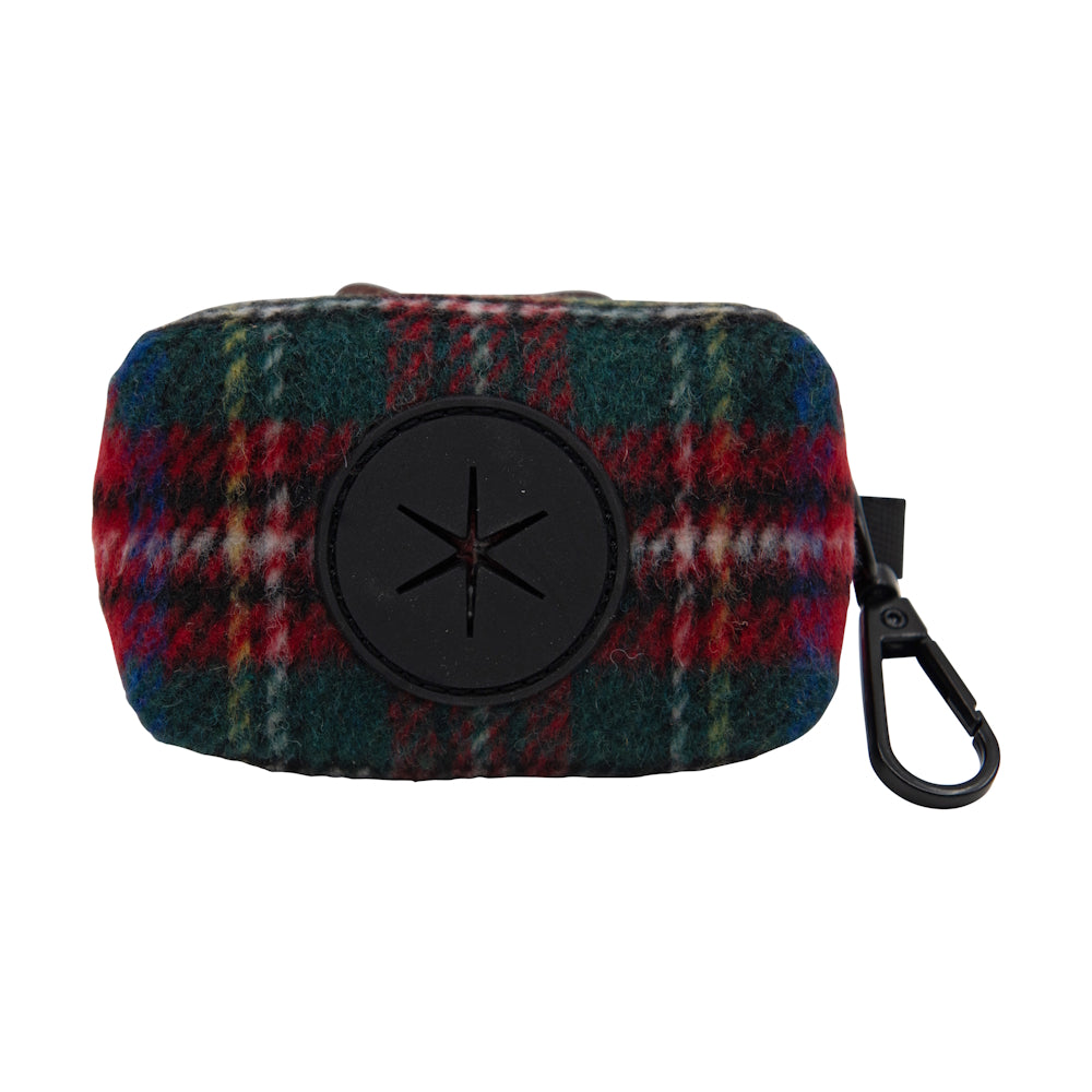 Small plaid fabric pouch with circular black opening and attached clip