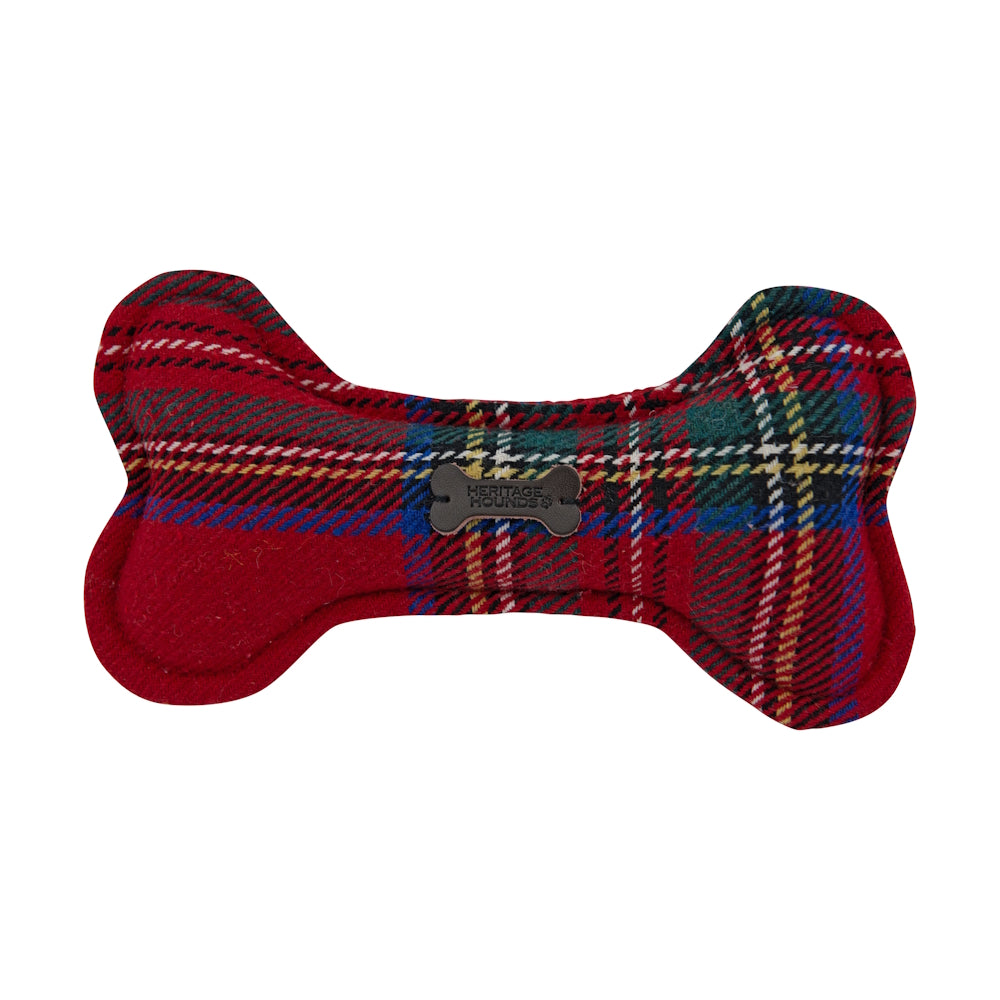 Red plaid fabric dog bone-shaped chew toy with a small label in center