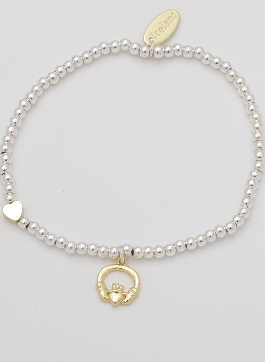Silver beaded bracelet with gold heart and Claddagh charms
