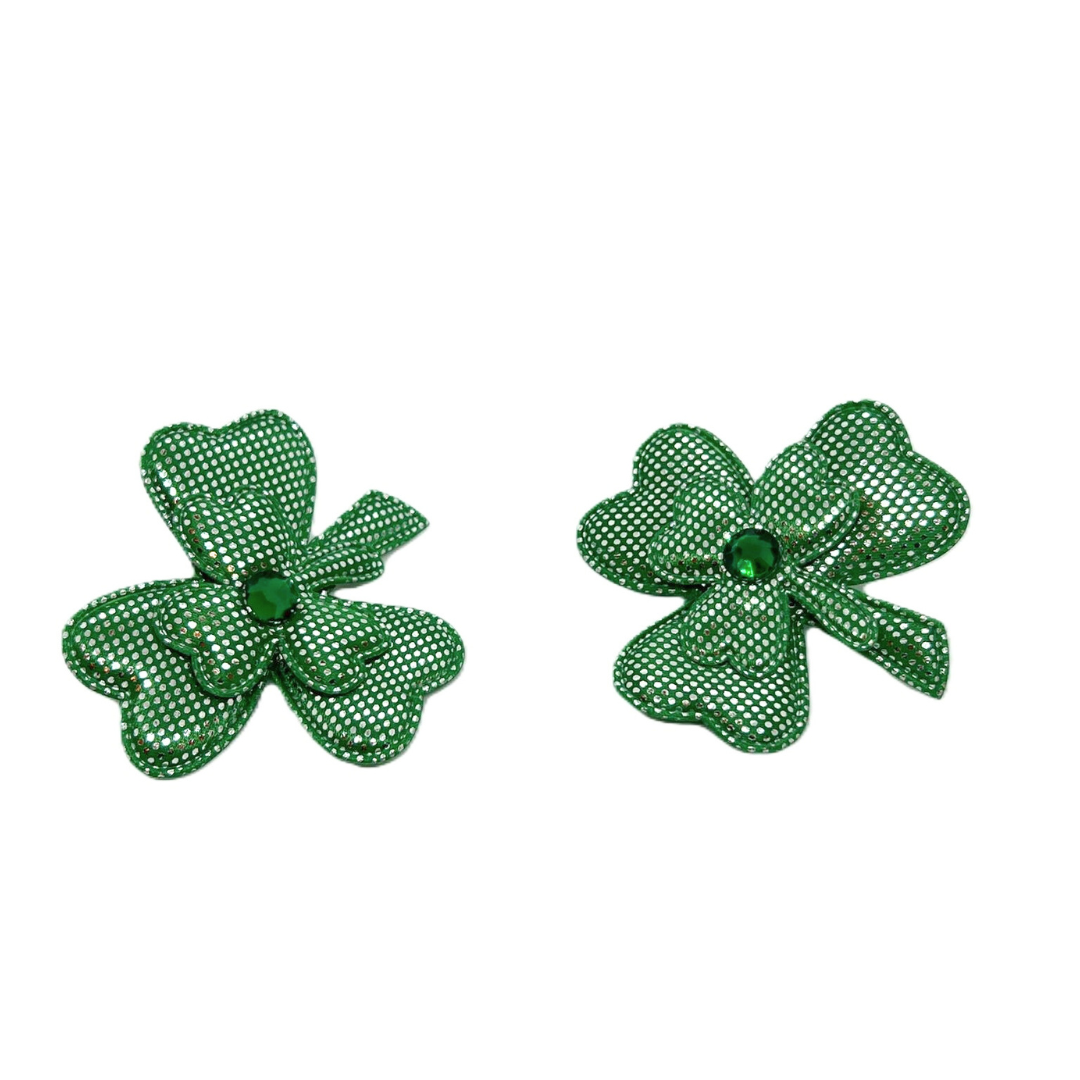 Two green fabric shamrocks with white polka dots and gem centers