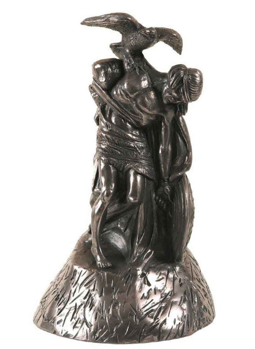 Bronze sculpture of two intertwined human figures with a bird above them