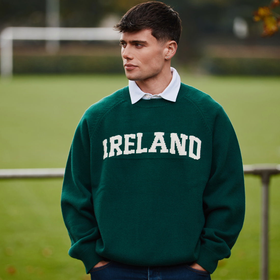 Male model wearing a green Ireland knitted jumper outdoors with a white collared shirt