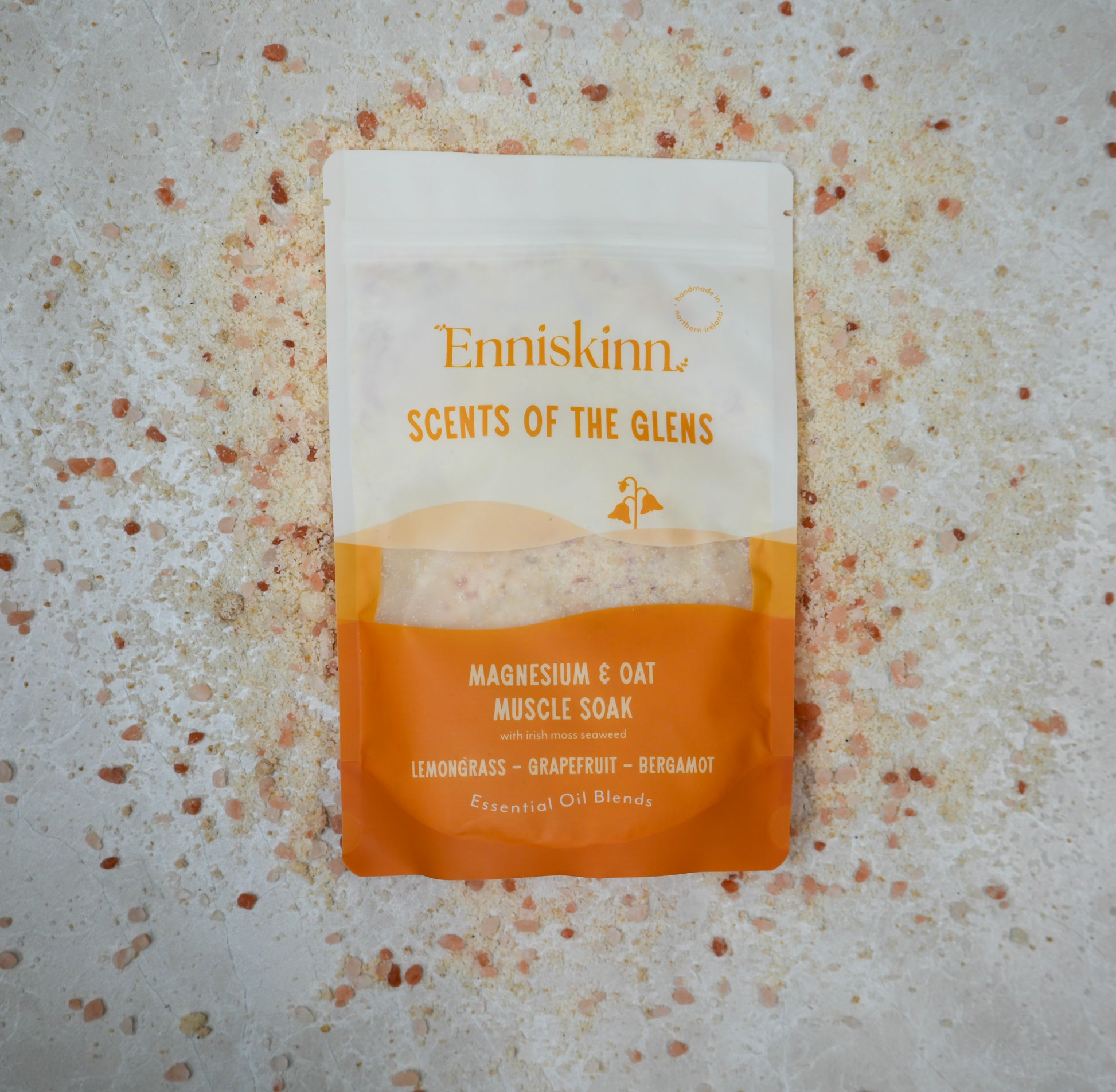 Enniskinn Scents of the Glens Magnesium & Oat Muscle Soak pouch with orange label on a speckled surface
