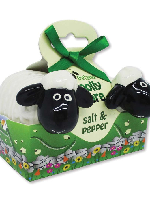 Black and white sheep-shaped salt and pepper shakers in green packaging