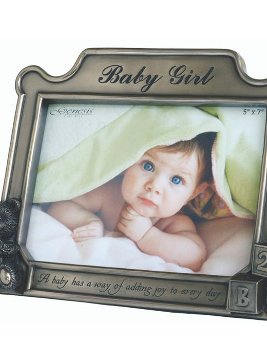 Metal photo frame with baby girl text, teddy bear, and blocks holding baby picture