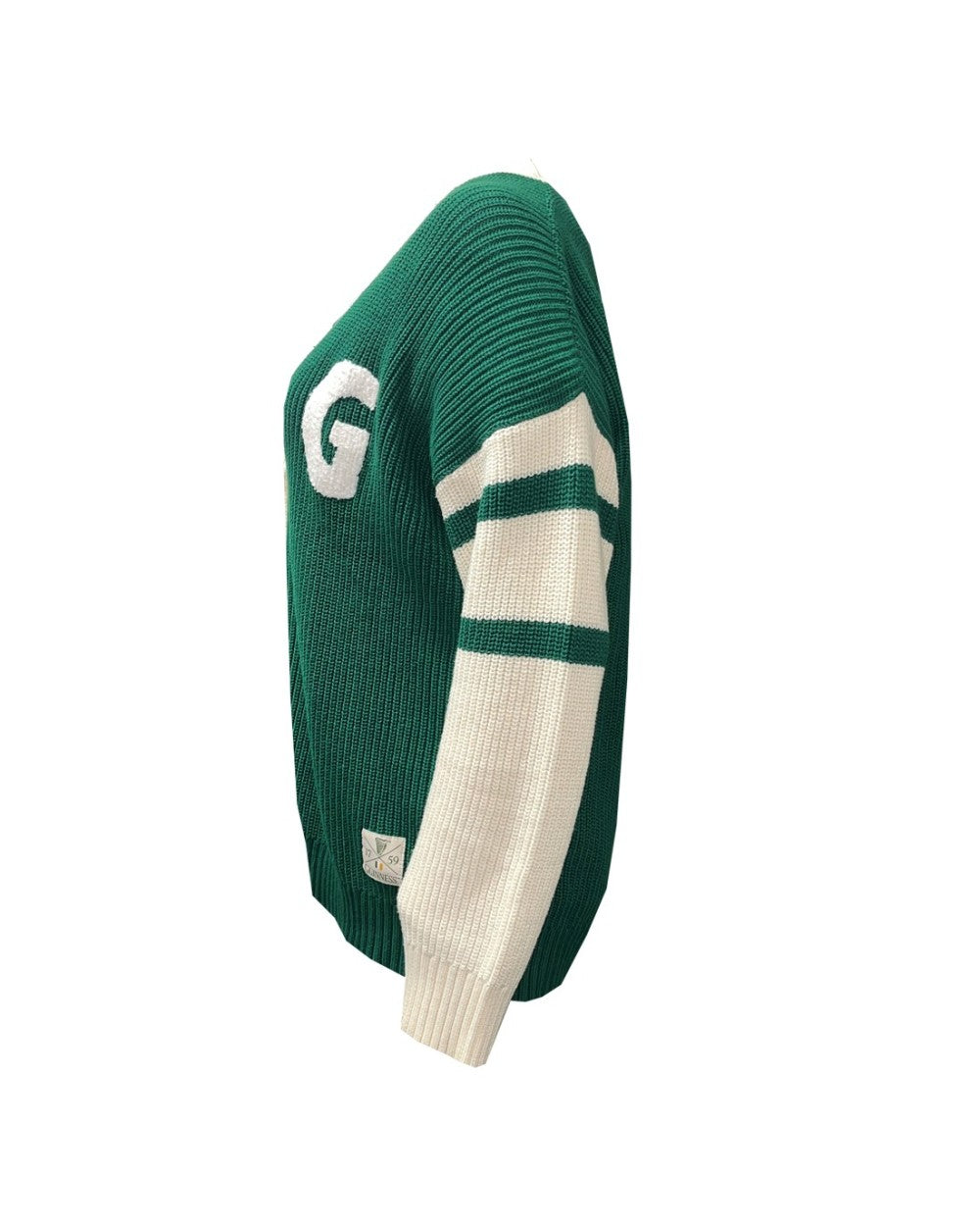 Side view of green and cream knitted cardigan with white sleeves and large G emblem on the front.