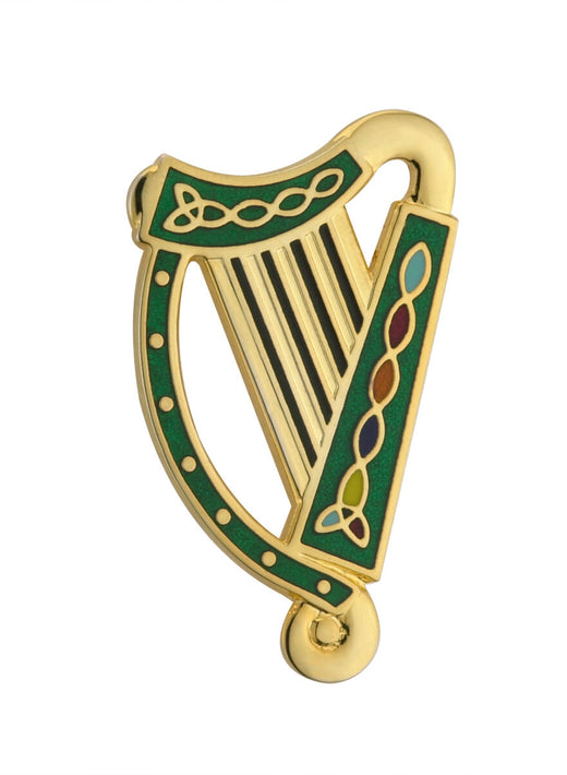 Gold and green harp-shaped pin with colorful Celtic designs